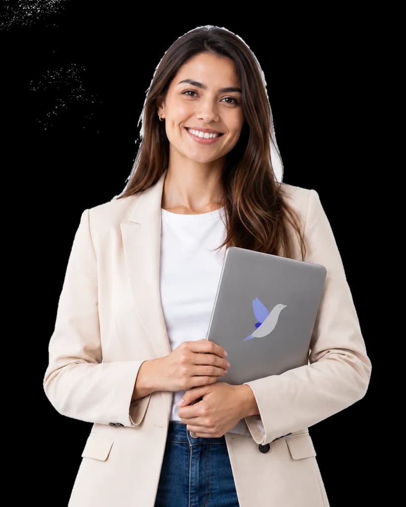 A smiling professional holding a laptop
